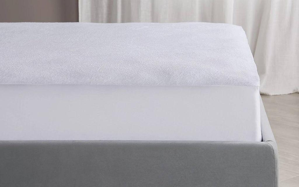 Terry mattress protector in a bedroom interior, view 1